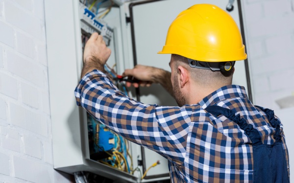 An electrician checking wires