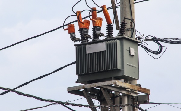 Electric transformer on utility pole