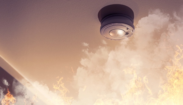 Smoke alarm beeping alerting house fire