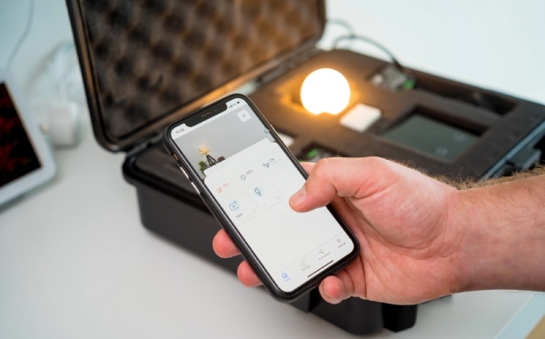 An electrician installing smart home system demo kit